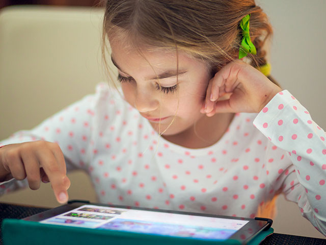 Little girl with a tablet