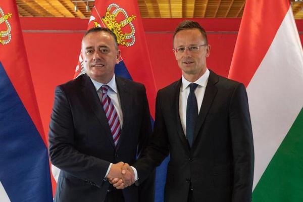 Aleksandar Antic, left, and Peter Szijjarto